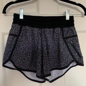 Lululemon athletic shorts, black floral, size 4